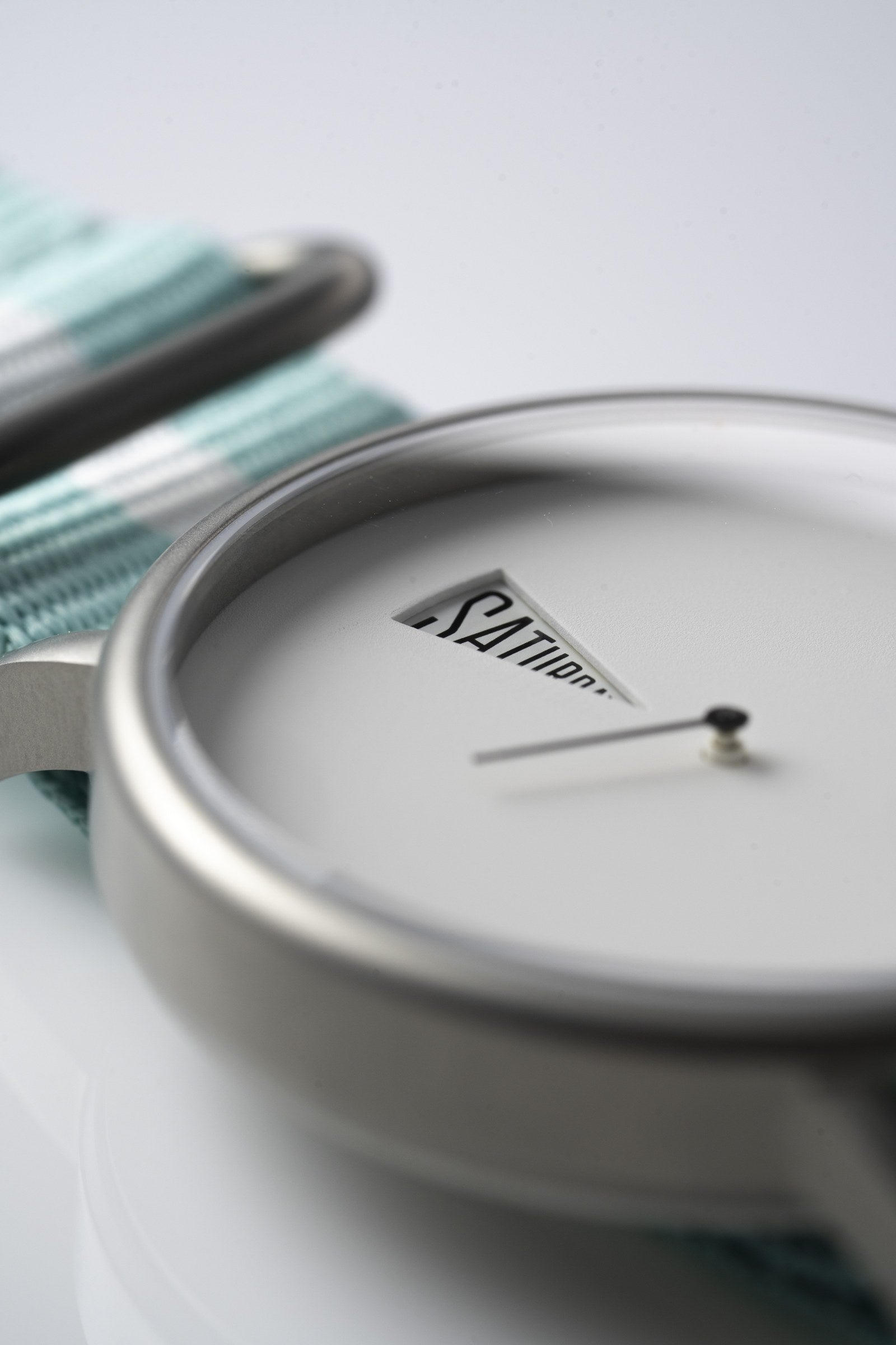 The Point White Daywatch — close-up of dial face showing SATURDAY on white dial
