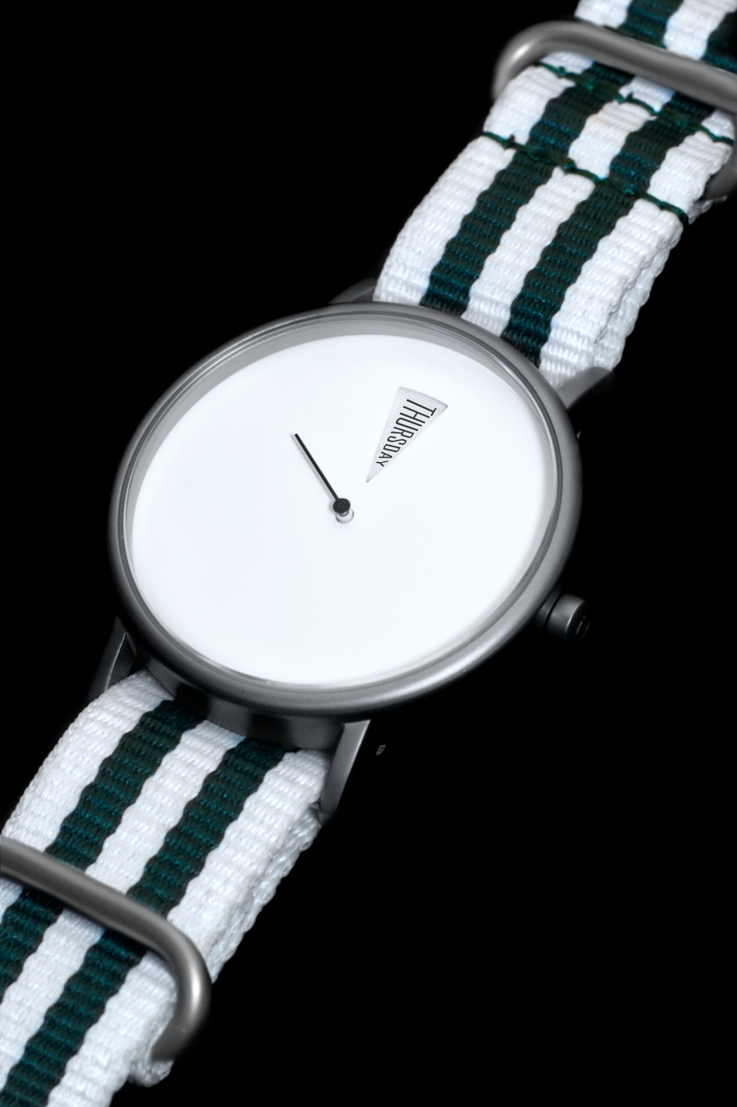 Detail shot of The Point White Daywatch — polished stainless steel case and domed sapphire crystal