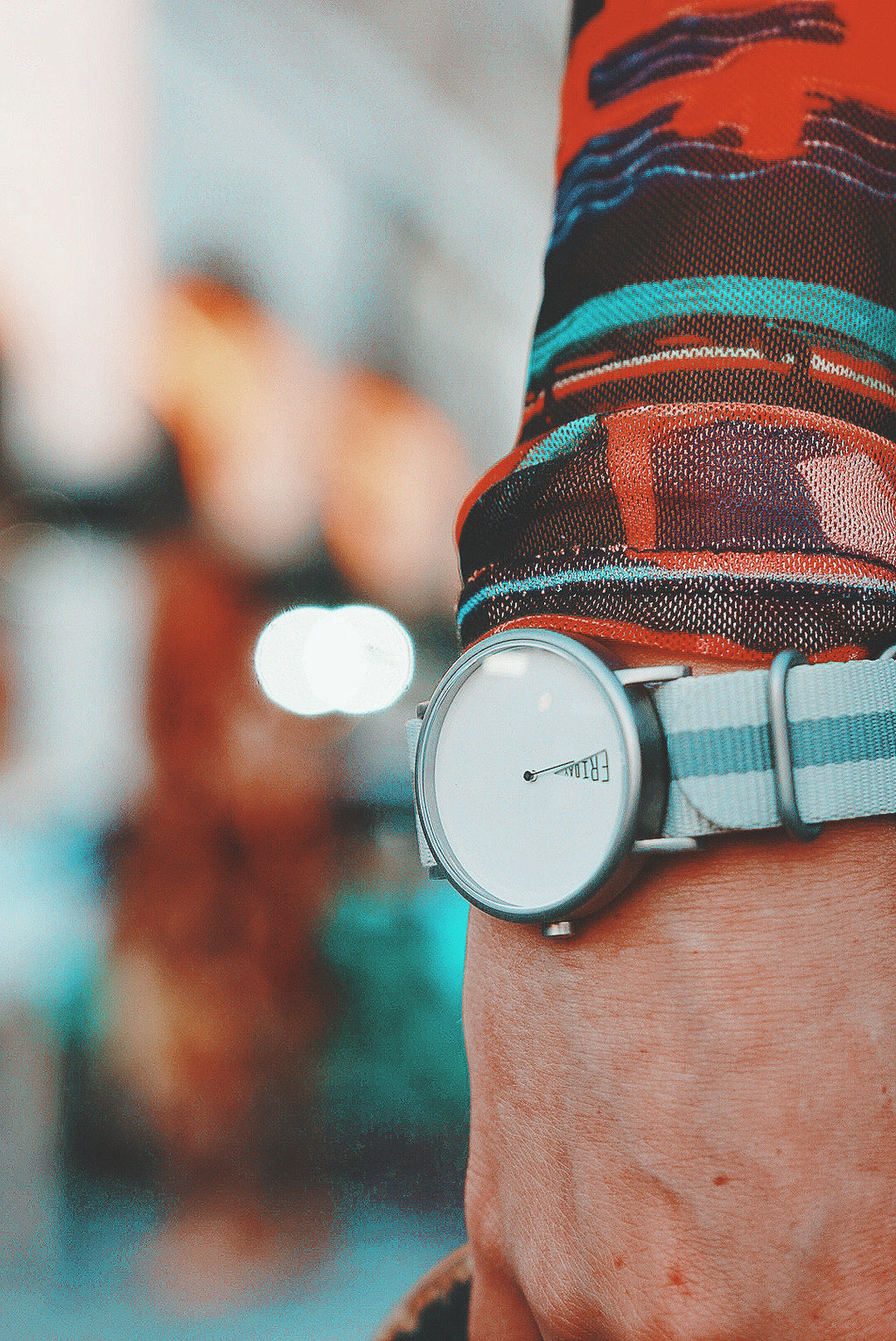The Point White Daywatch flat lay with striped NATO strap and grey pineapple leather band