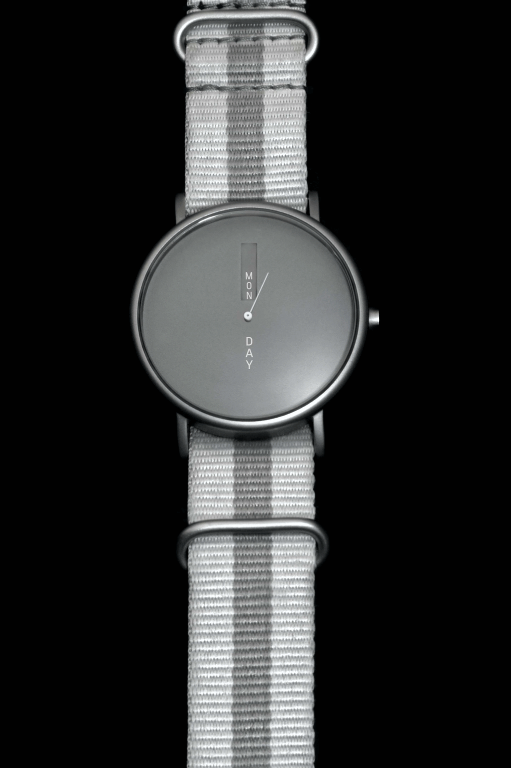 Animated close-up of The Monolith Daywatch dial window rotating through days of the week